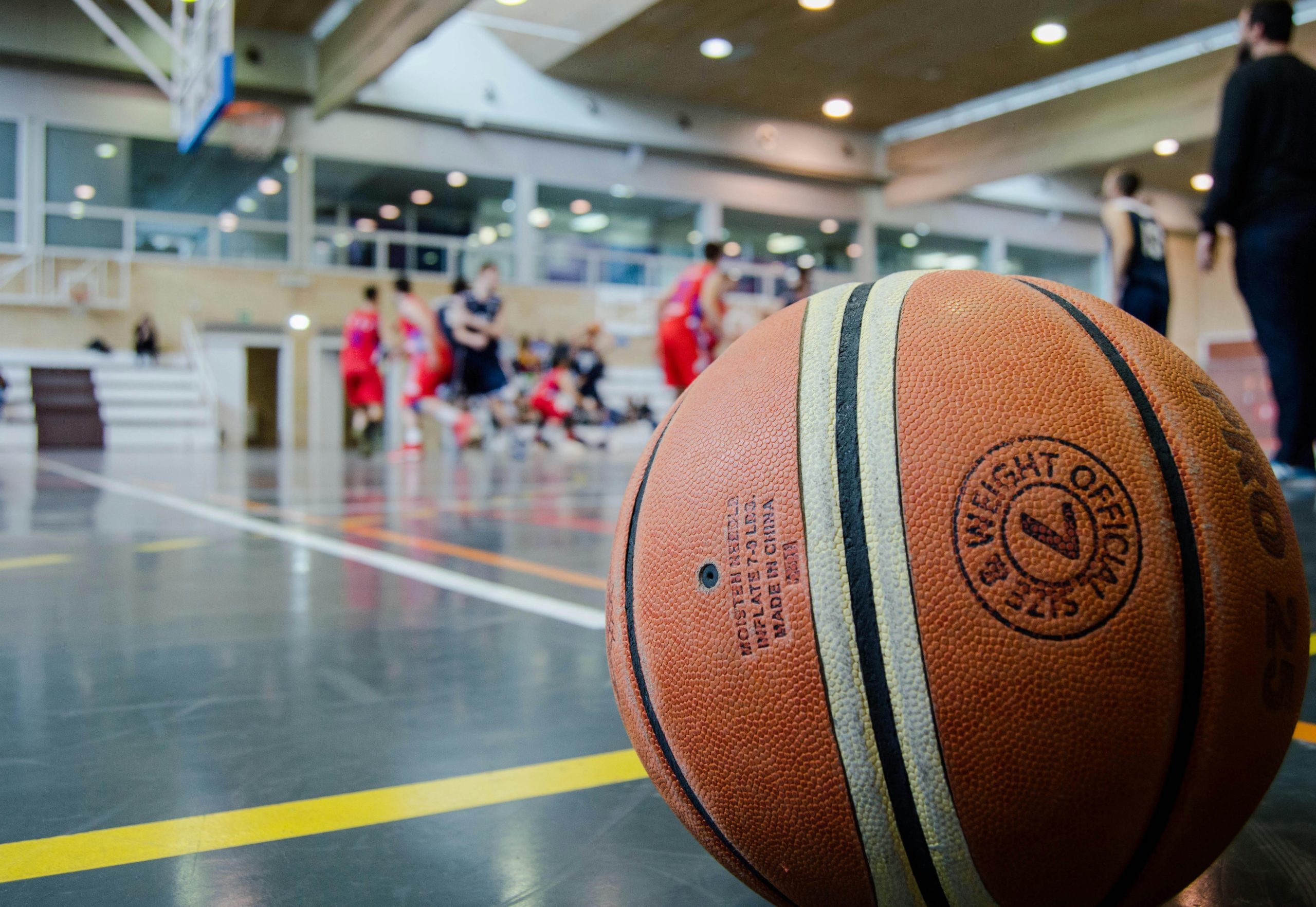 Captivating indoor basketball scene with players actively engaged in a game.